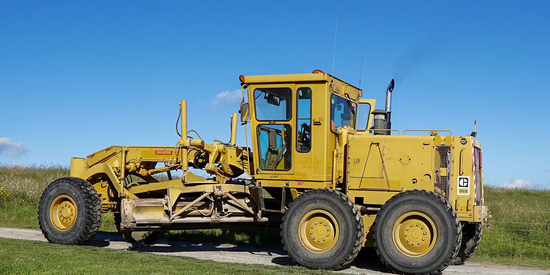 Motor grader used for road leveling and site preparation